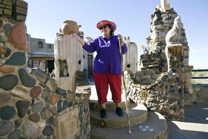 Reta Dunham, a tour guide at Mystery Castle in Phoenix where Mary Lou Gulley used to live and maintain the property, talks in this Dec. 12, 2010 photo. Gulley recently passed away, but the castle still remains as her father had built it.