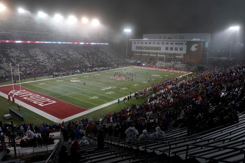 Light snow falls at Martin Stadium during game between Washington State and Arizona, Friday, Nov. 19, 2021, in Pullman, Wash.