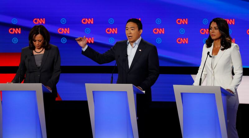 From left, Sen. Kamala Harris, D-Calif., Andrew Yang and Rep. Tulsi Gabbard, D-Hawaii, participate in the second of two Democratic presidential primary debates hosted by CNN Wednesday, July 31, 2019, in the Fox Theatre in Detroit. (AP Photo/Paul Sancya)