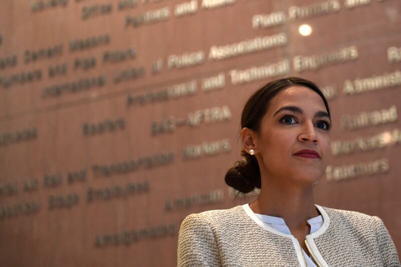 Rep.-elect Alexandria Ocasio-Cortez, D-N.Y., listens during a news conference with members of the Progressive Caucus in Washington, Monday, Nov. 12, 2018.