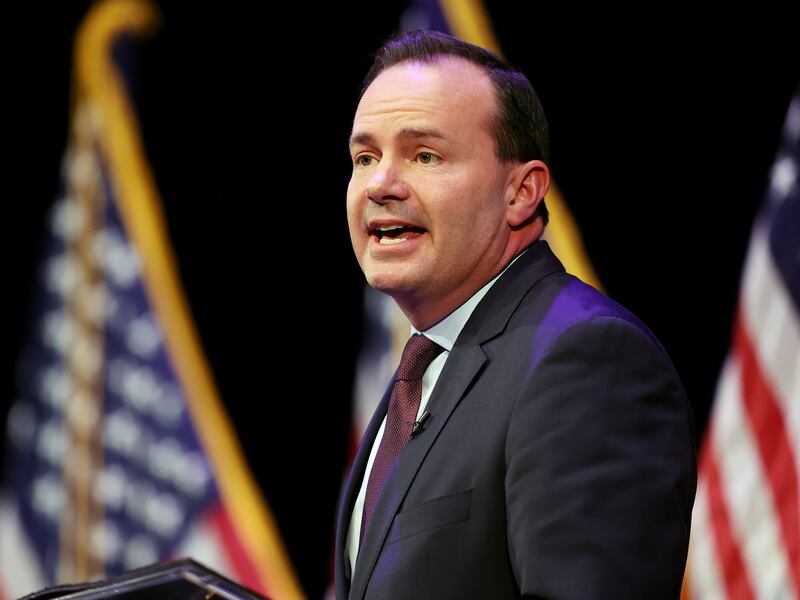Sen. Mike Lee answers a question during a Utah GOP sponsored debate at Draper Park Middle School.