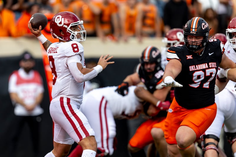 Oklahoma quarterback Dillon Gabriel (8) passes the ball as Oklahoma State nose tackle Justin Kirkland (97) pressures him during game Saturday, Nov. 4, 2023, in Stillwater, Okla. Kirkland transferred to BYU in the offseason.