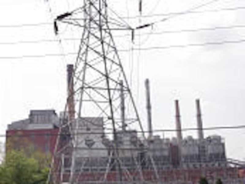 Electric transmission lines lead away from Cinergy's Beckjord power plant in New Richmond, Ohio. Duke Energy, based in Charlotte, N.C., is planning to buy Cinergy.
