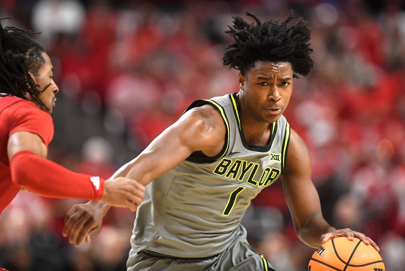 Baylor guard Robert Wright III (1) dribbles the ball during game against Texas Tech, Tuesday, Feb. 4, 2025, in Lubbock, Texas.