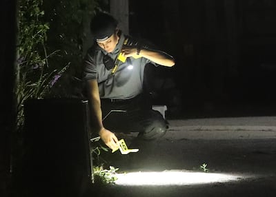 Technicians process possible evidence on the driveway of a home at 547 N. 1000 West in Salt Lake City in connection to the disappearance of University of Utah student Mackenzie Lueck on Wednesday, June 26, 2019.