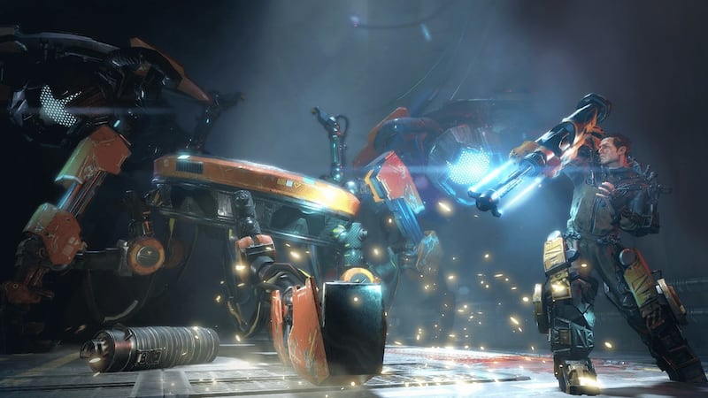 A rampaging robot attacks an exosuit-wearing survivor in "The Surge."