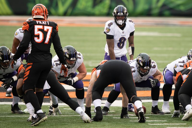 Baltimore Ravens quarterback Lamar Jackson (8) calls a play during an NFL football game against the Cincinnati Bengals.