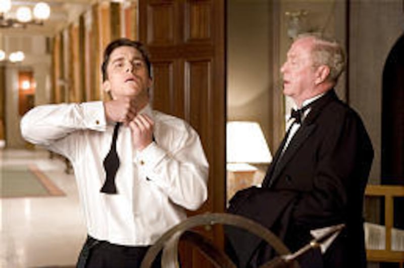 Michael Caine, right, plays Alfred Pennyworth, Batman's (Christian Bale) trusty and moral butler.