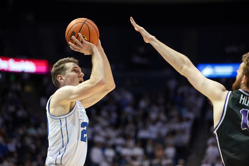 BYU guard Spencer Johnson (20) shoots during the game against the Evansville Aces on Tuesday, Dec. 5, 2023.