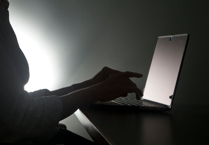 In this Monday, Dec. 12, 2016, file photo illustration, a person types on a laptop, in Miami. A 2016 Pew Research Center study said 41 percent of U.S. adults have experienced online harassment, ranging from offensive name-calling to stalking and sexual ha