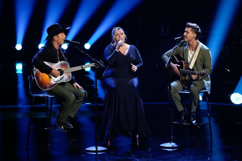 Dek of Hearts performs during the Playoff round of "The Voice." The Nashville-based trio won a performance slot in the Rose Parade.