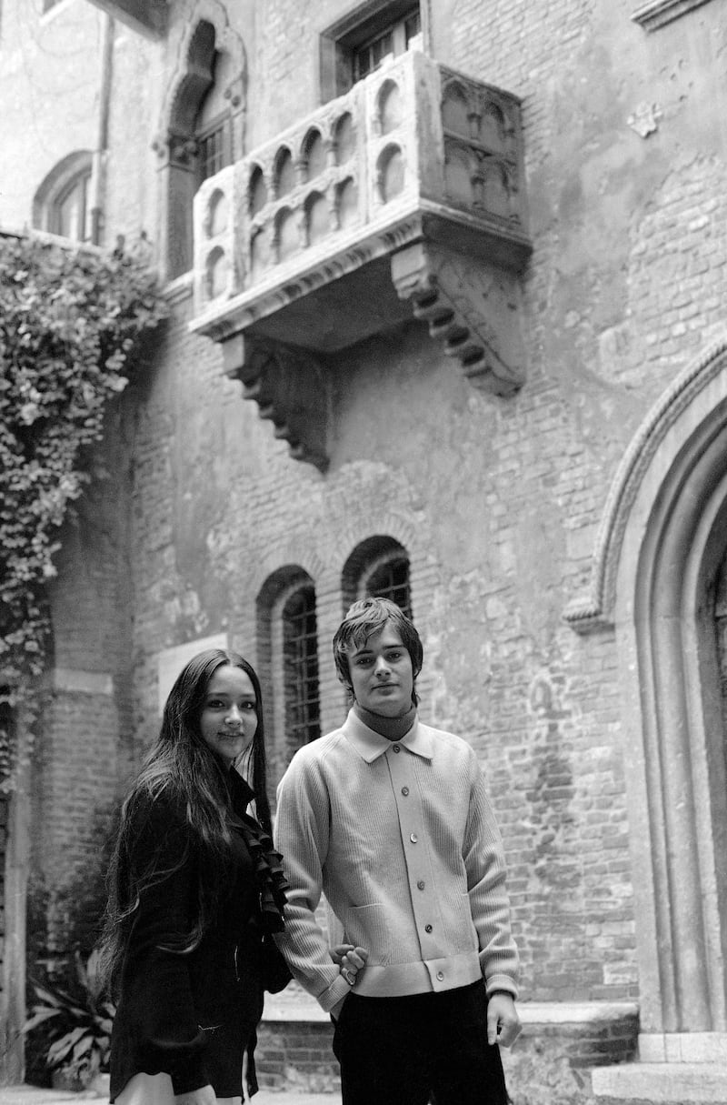 British actress Olivia Hussey and actor Leonard Whiting stand under the balcony of the Capulet family’s home in Verona, northern Italy.