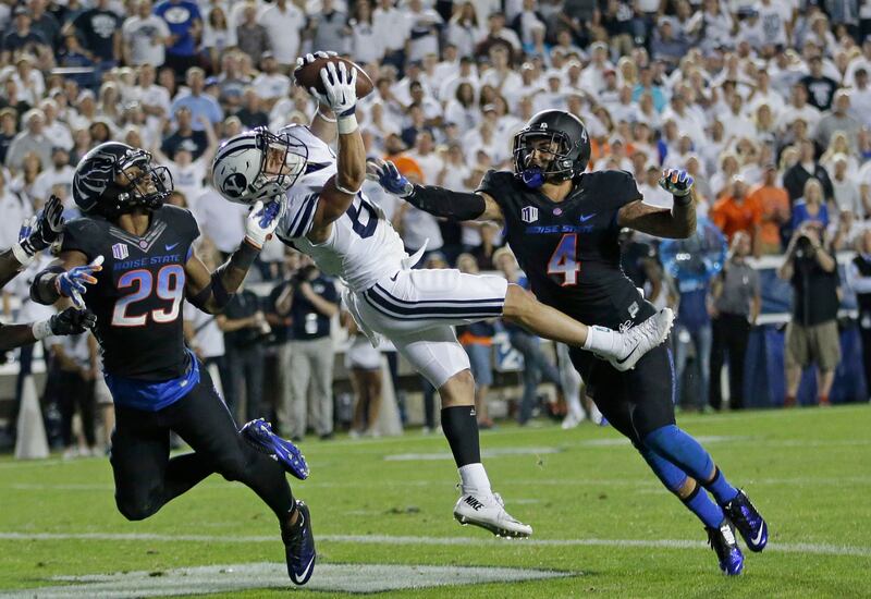 BYU wide receiver Mitchell Juergens, center, catches the go-ahead touchdown vs. Boise State, Sept. 12, 2015, in Provo, Utah.