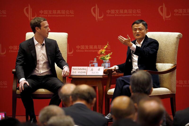 Facebook CEO Mark Zuckerberg, left, listens as Jack Ma, executive chairman of the Alibaba Group, speaks during a panel discussion held as part of the China Development Forum at the Diaoyutai State Guesthouse in Beijing, Saturday, March 19, 2016.