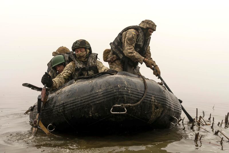 A group of Ukrainian marines sail from the riverbank of Dnipro at the front line near Kherson, Ukraine.