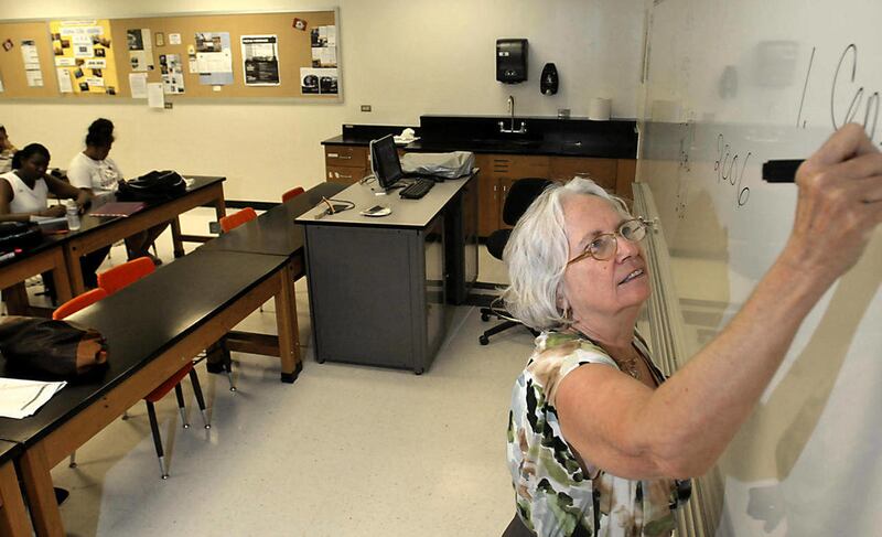 New Mexico State University Assistant Professor Joan Crowley teaches a criminal justice class on Aug. 31, 2011, at the university in Las Cruces, N.M. Two years of successive financial cuts at New Mexico State University, a trickle-down effect of the stat
