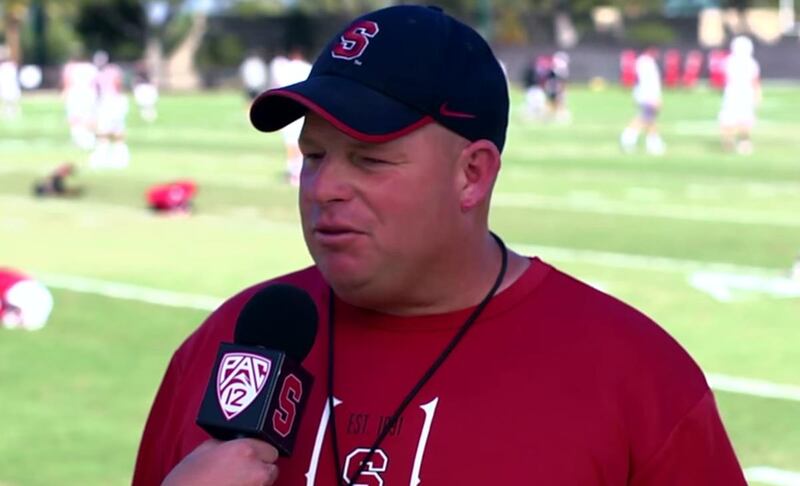 Lance Anderson talks with a reporter in 2014 about Stanford's defense.