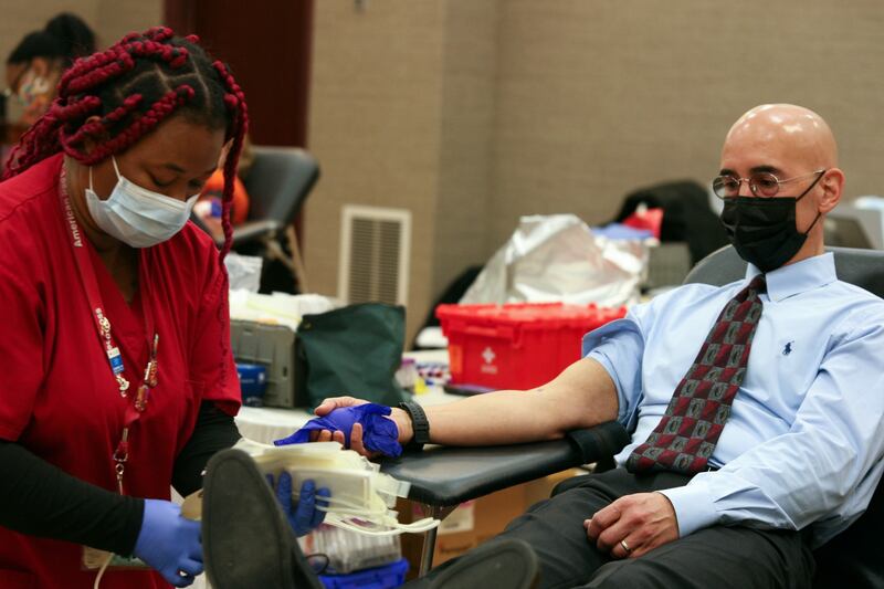 American Red Cross Divisional Vice President David Staszak donates blood in Fenton, Missouri, March 3, 2021.