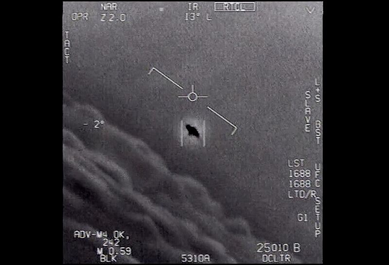 An unexplained object is seen at center as it is tracked as it soars high along the clouds, traveling against the wind.