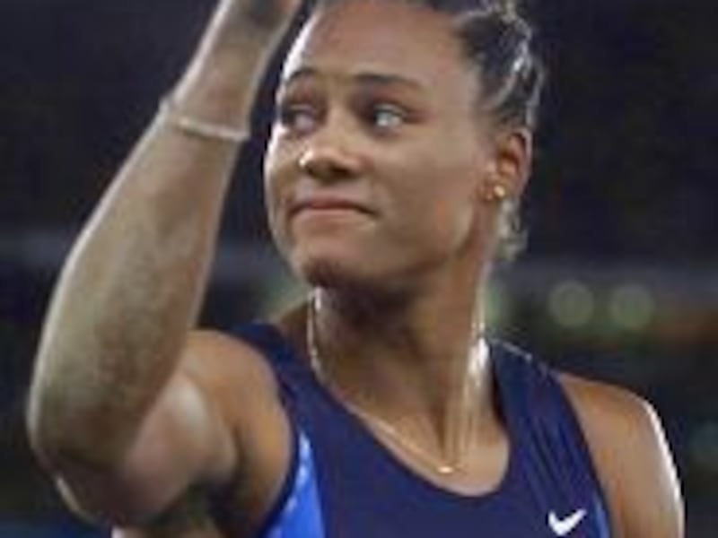 U.S. track and field star Marion Jones gives the thumbs<BR> up to the crowd after winning the bronze in long jump.
