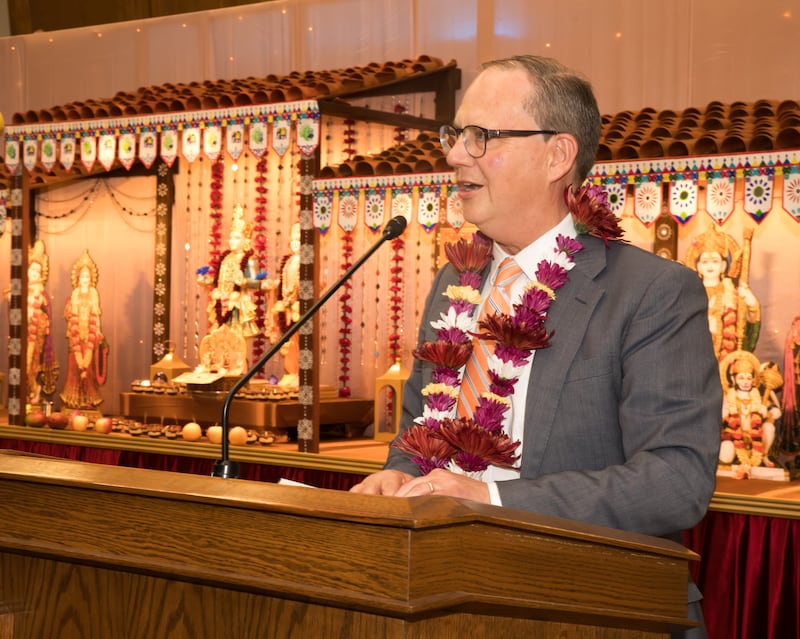 Michael Frandsen of the communication department of The Church of Jesus Christ of Latter-day Saints reads a letter written by Elder Matthew S. Holland, a General Authority Seventy of the church, during a gathering held in the BAPS mandir in Kearns, Utah, on Saturday, Nov. 22, 2025.
