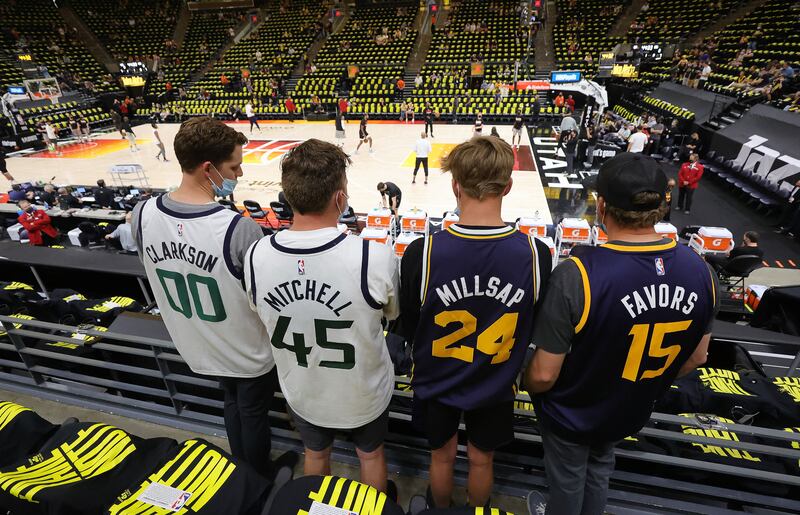 Four Utah Jazz fans wearing “Clarkson,” “Mitchell,” “Millsap” and “Favors” jerseys watch pregame activities for Game 5 of the NBA playoffs between the Utah Jazz and the LA Clippers in Salt Lake City on Wednesday, June 16, 2021.