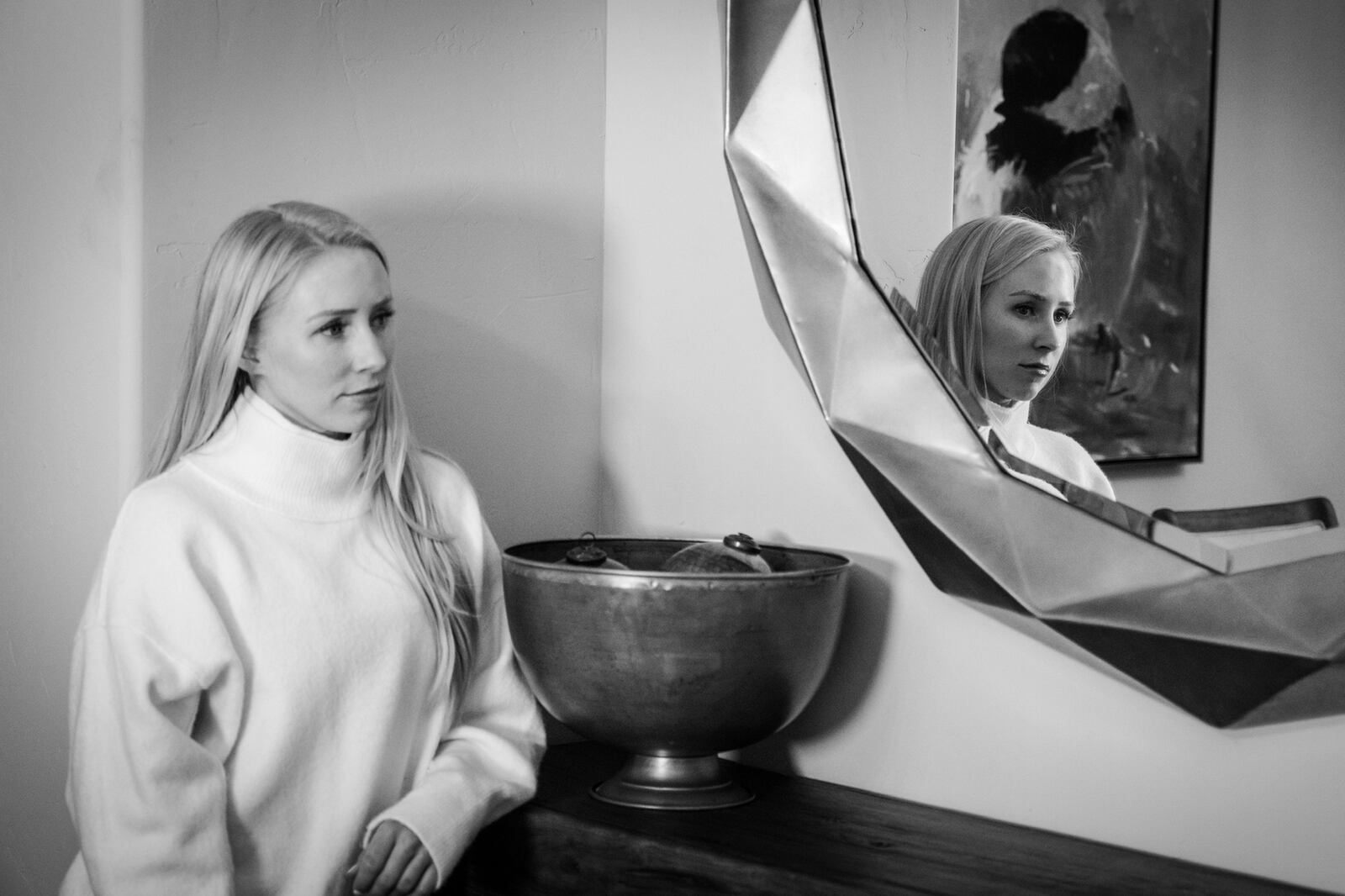 Whitney Fredette stands next to a mirror in her Colorado home.
