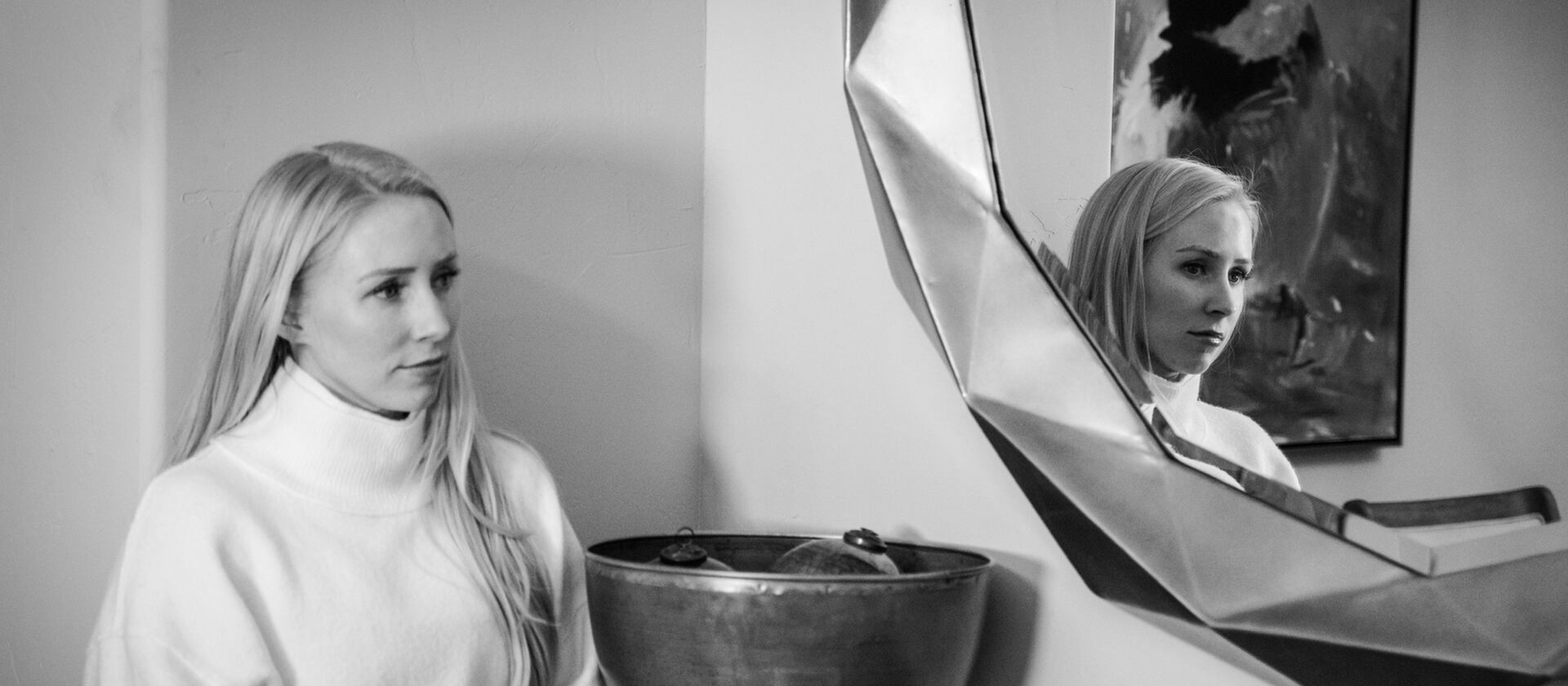 Whitney Fredette stands next to a mirror in her Colorado home.
