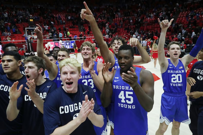 Brigham Young Cougars celebrate their win in Salt Lake City against the University of Utah.