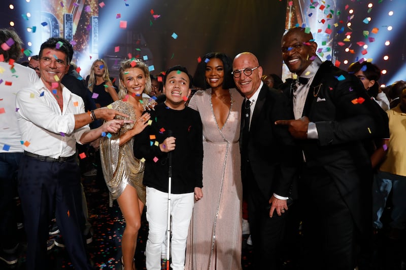 Simon Cowell, Julianne Hough, Kodi Lee, Gabrielle Union, Howie Mandel, Terry Crews celebrate in the finale episode of “America’s Got Talent.”