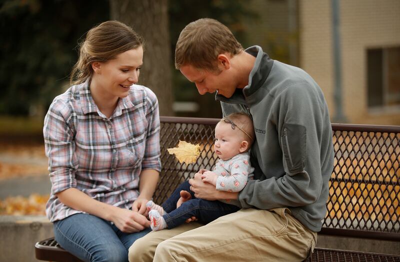 Spencer and Lauren Hanson sit near their home with daughter Lyla in Provo on Nov. 4, 2017. They have been married two years.