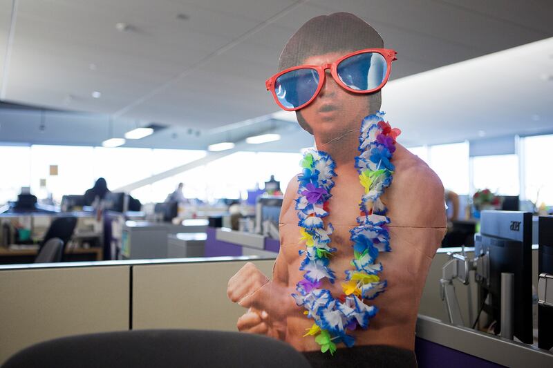 A cardboard cutout is adorned with big sunglasses and a lei at CHG Healthcare Services' headquarters in Midvale on Wednesday, Aug. 8, 2018. Workers are wearing more casual attire as dress codes loosen, according to the Employers Council’s Miscellaneous Be