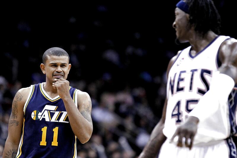 Jazz guard Earl Watson, left, got in Monday's game early.