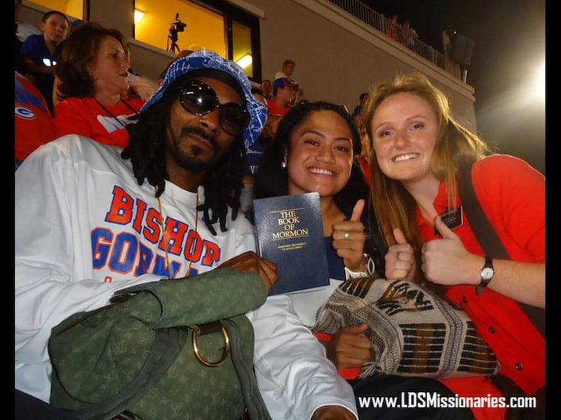 Rapper Snoop Dogg with Sisters Andelin and \'Otukolo at a football game at Bishop Gorman High School in Las Vegas in September 2014