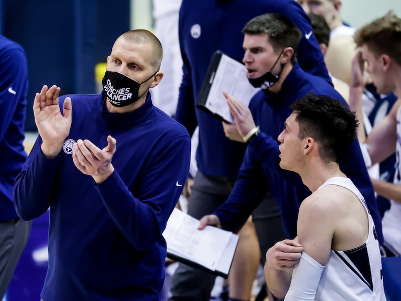 BYU coach Mark Pope claps on the sideline of a game against the Pacific Tigers at the Marriott Center in Provo.