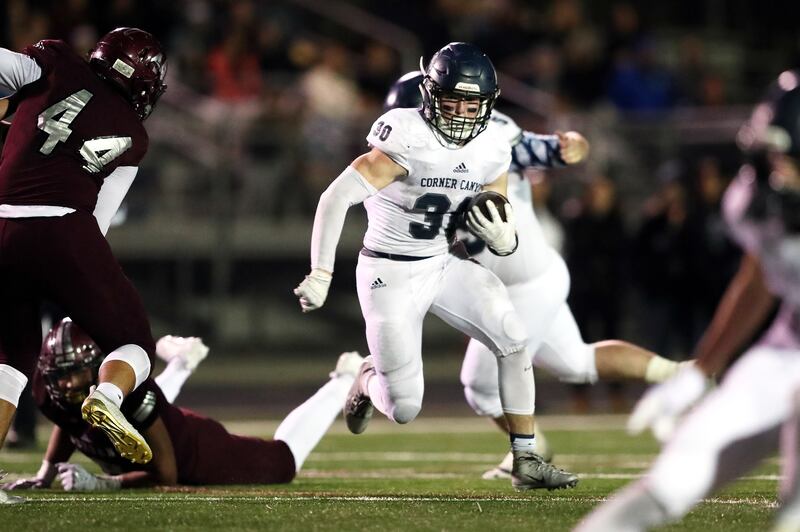 Corner Canyon's Caden Johnson turns the corner on a run as they and Jordan play on Wednesday, Oct. 17, 2018. Corner Canyon won 28-20.