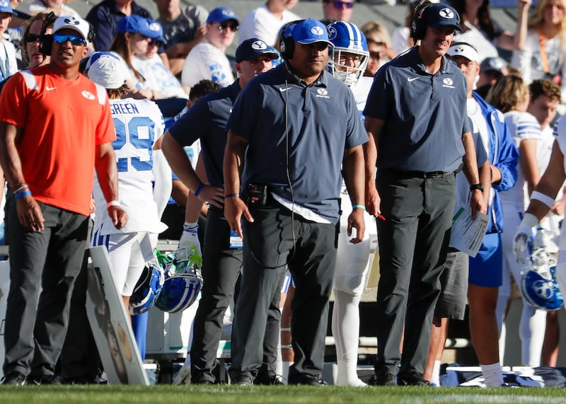 BYU coach Kalani Sitake, center, stands on the sideline as his team plays Arkansas Razorbacks in Provo on, Oct. 15, 2022.
