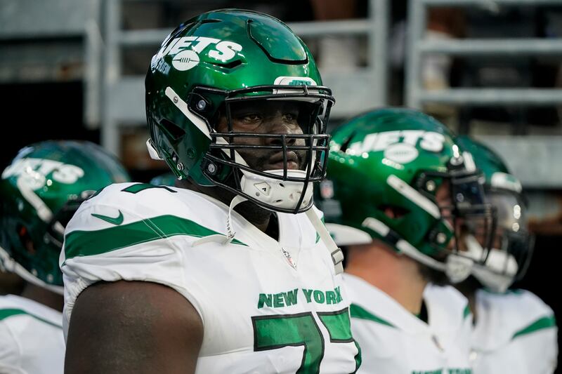 New York Jets offensive tackle Mekhi Becton waits to take the field before an NFL preseason football game against the New York Giants.