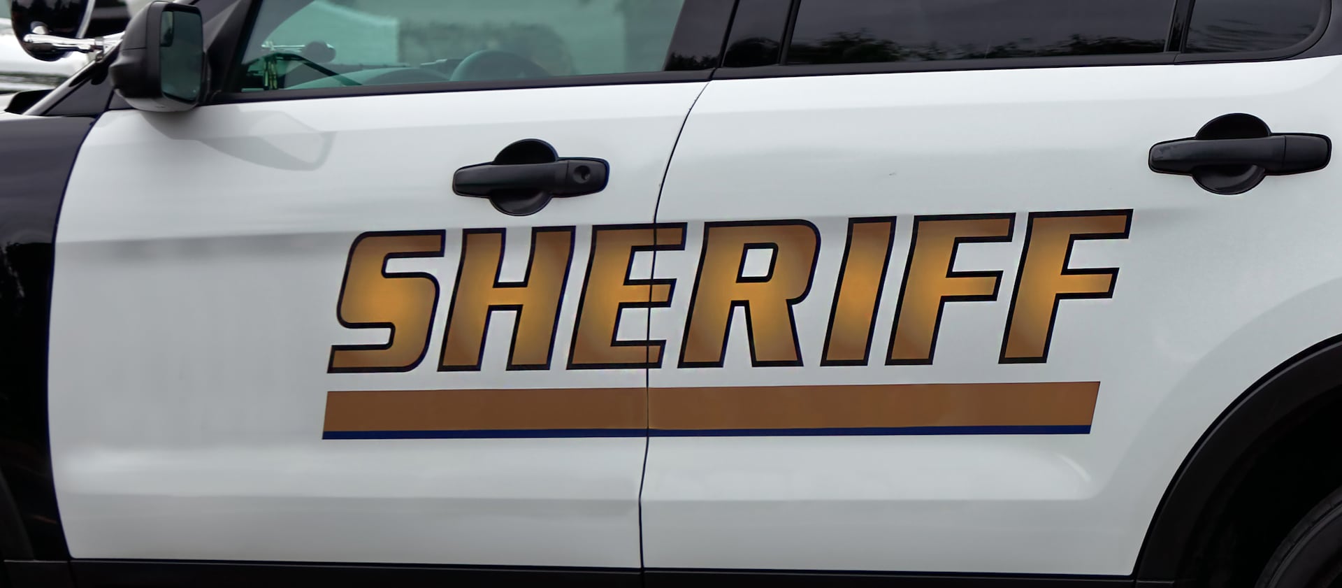 The Garfield County sheriff defended a deputy who arrested a woman after she allegedly crumpled up a pro-police sign.