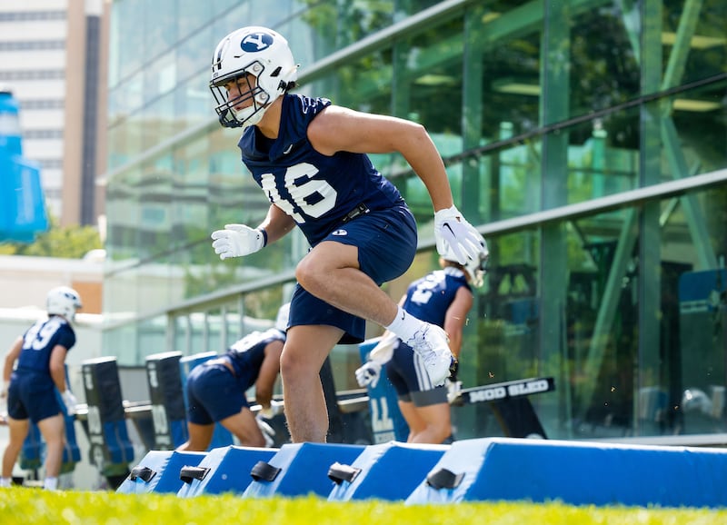 BYU linebacker Logan Pili does a drill