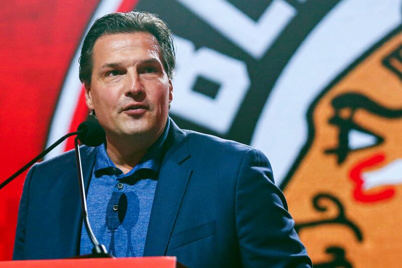 In this July 26, 2019, file photo, former Chicago Blackhawks player Eddie Olczyk speaks during the NHL hockey team's convention in Chicago.