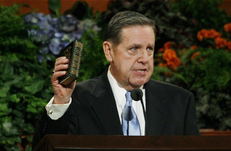 Elder Jeffrey R. Holland holds a Book of Mormon that Hyrum Smith read from and used to comfort his brother Joseph Smith while leaving for Carthage Jail during LDS General Conference in Salt Lake City, Utah, Sunday, Oct. 4, 2009.