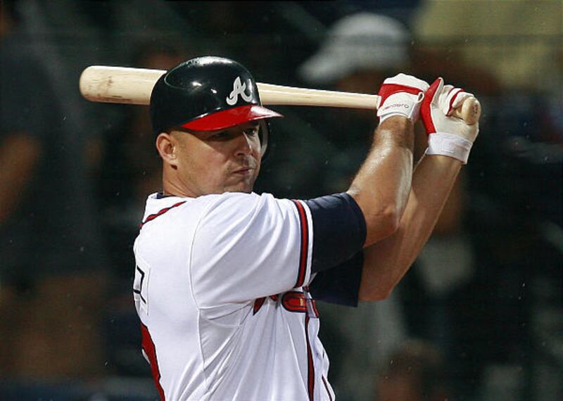Javier Vazquez drives in a run with a single in the first inning, part of 17 hits for the Braves.