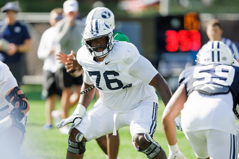 BYU offensive lineman Caleb Etienne looks to pass block during a practice Aug. 6, 2024, in Provo.