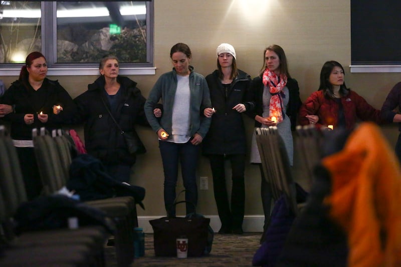 Family, friends and colleagues gather for a candlelight vigil in memory of Dr. Sarah Hawley at the University of Utah Guest House in Salt Lake City on Monday, Feb. 4, 2019. Hawley was killed by her boyfriend in what police believe to be a murder-suicide o