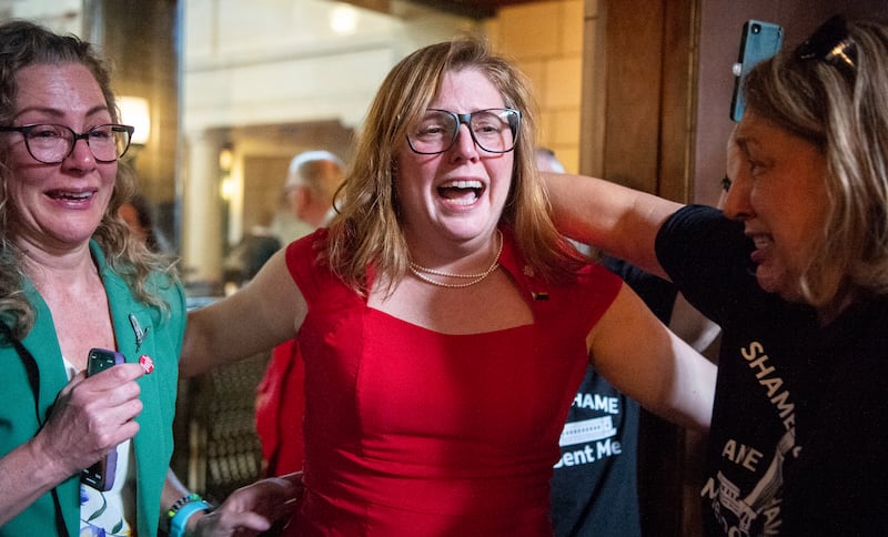 State Sen. Machaela Cavanaugh, center, hugs supporters after a bill seeking to ban abortion in Nebraska after about six weeks fails to advance.