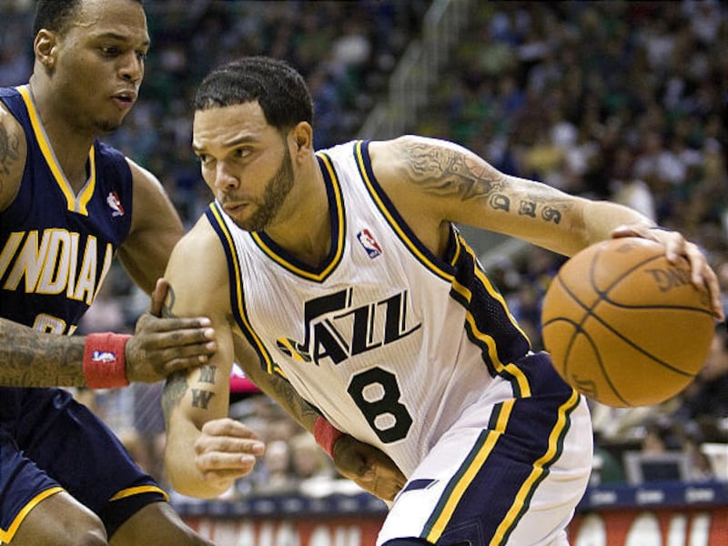 Utah's Deron Williams drives to the basket past Indiana's Brandon Rush during the Jazz's comfortable win.