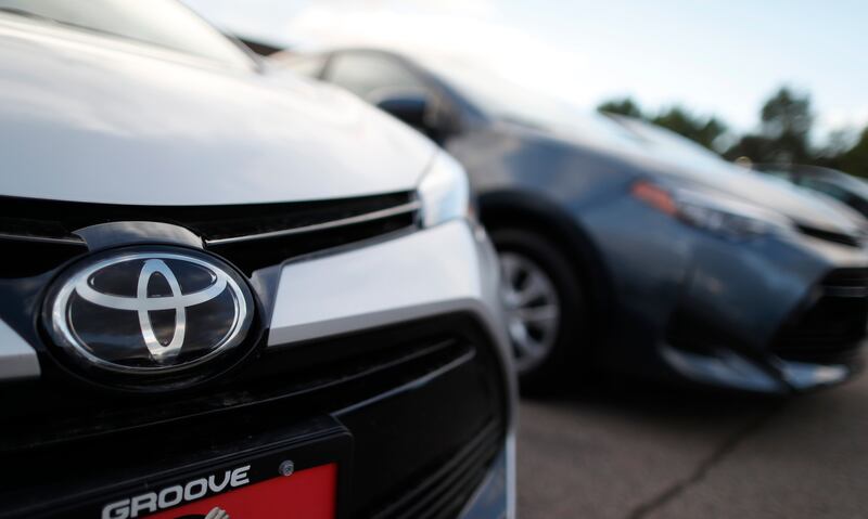 FILE - This Sunday, June 24, 2018 file photo shows the Toyota company logo on a car at a Toyota dealership in Englewood, Colo. (AP Photo/David Zalubowski, File)