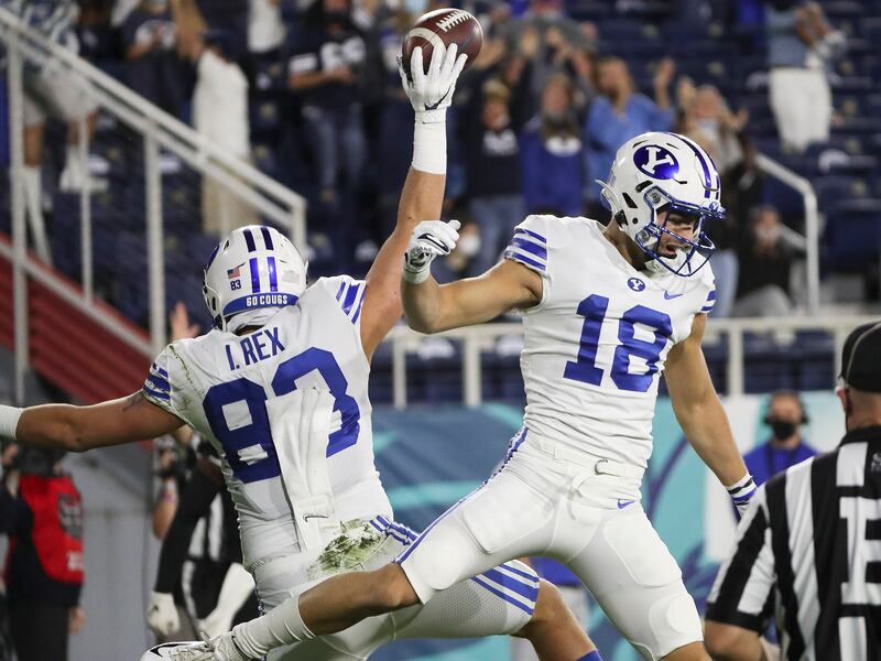 BYU tight end Isaac Rex celebrates his touchdown with BYU wide receiver Gunner Romney in Boca Raton, Florida.