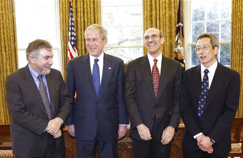 President George W. Bush poses for a photo Monday with Nobel Prize winners in the Oval Office of the White House. From left are, Dr. Paul Krugman of New York for economics; the president; Dr. Martin Chalfie of New York for chemistry; and Dr. Roger Tsien o